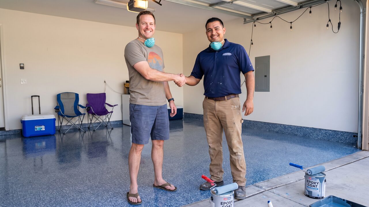 Epoxy garage floor Phoenix contractor and homeowner during holiday weekend garage floor installation