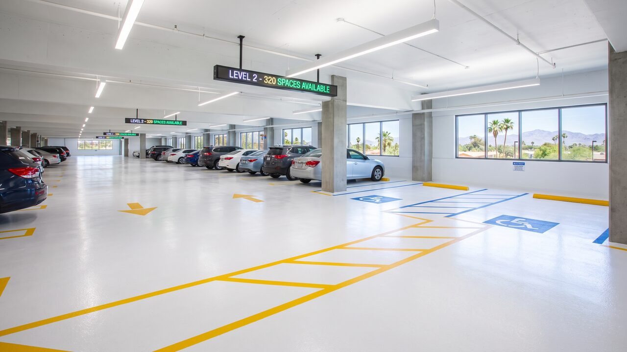 Well-organized Phoenix parking garage interior with bright white epoxy coating and ADA line striping