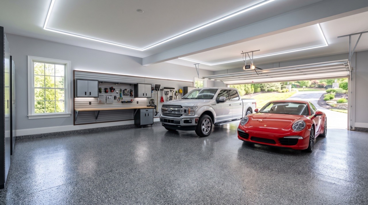 Luxury residential garage with dark metallic epoxy floor in Phoenix